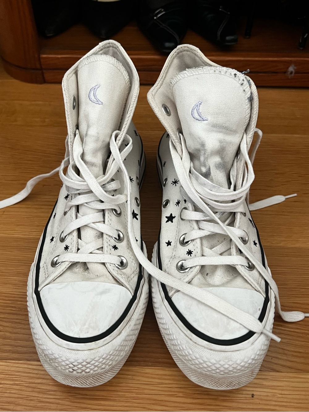 Converse White High-Top Sneakers with Black Star Print